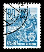 Frau auf Mähdrescher - Briefmarke DDR 1953